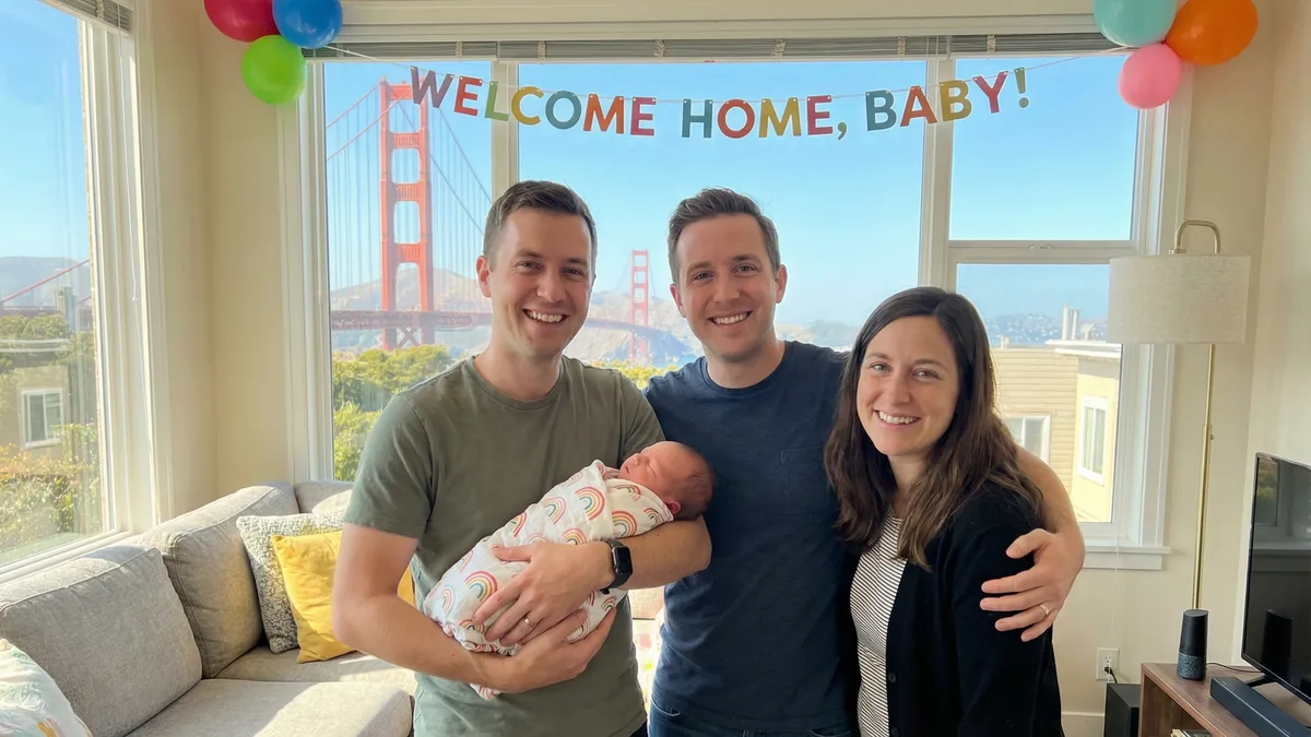 A joyful LGBTQ+ family celebrates their new baby&rsquo;s homecoming with Babytree Surrogacy support, sharing smiles and happiness. babytree