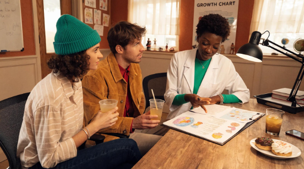 A Babytree Surrogacy doctor explains brain health to two young patients in a friendly, helpful setting made for kids and families. babytree